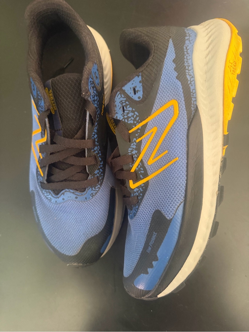 New Balance Blue and Yellow Trail Running Sneakers